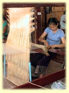 Weaver at loom.